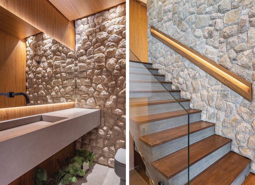 O décor do lavabo evidencia a criatividade do profissional ao explorar as diferentes possibilidades estéticas da madeira, concreto e pedra natural,  executada com maestria. A combinação dos elementos, destacada pela iluminação, permeia todos os detalhes do projeto. A escadaria com guarda-corpos transparentes, da Vitec, destaca a combinação dos degraus de madeira, fornecidos pela Maderatto, com a parede  de fundo de pedra natural. O elegante corrimão com fita de LED dá o toque final ao acesso ao pavimento superior